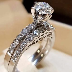 Ladies engagement ring and band silver set